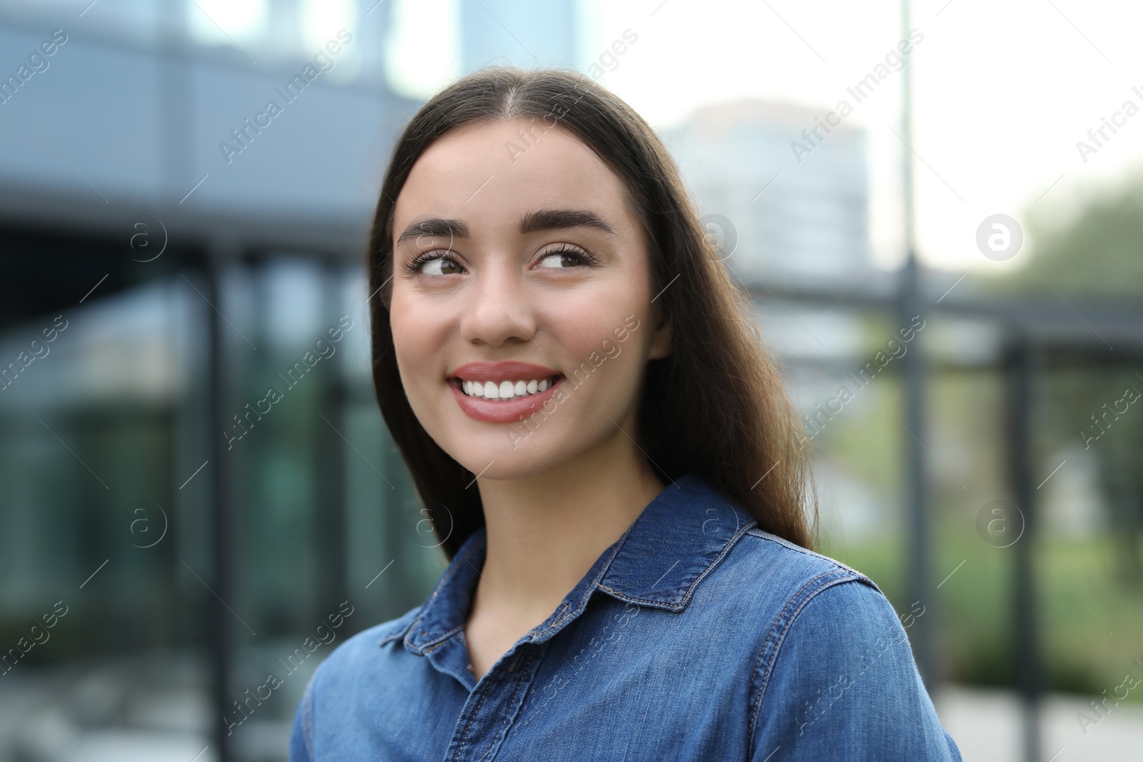 Photo of Portrait of beautiful woman outdoors. Attractive lady smiling outdoors