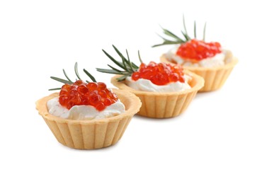Photo of Delicious tartlets with red caviar and cream cheese on white background