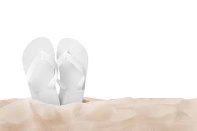 Photo of Bright flip flops in sand on white background