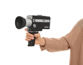 Photo of Woman with vintage video camera on white background, closeup of hand
