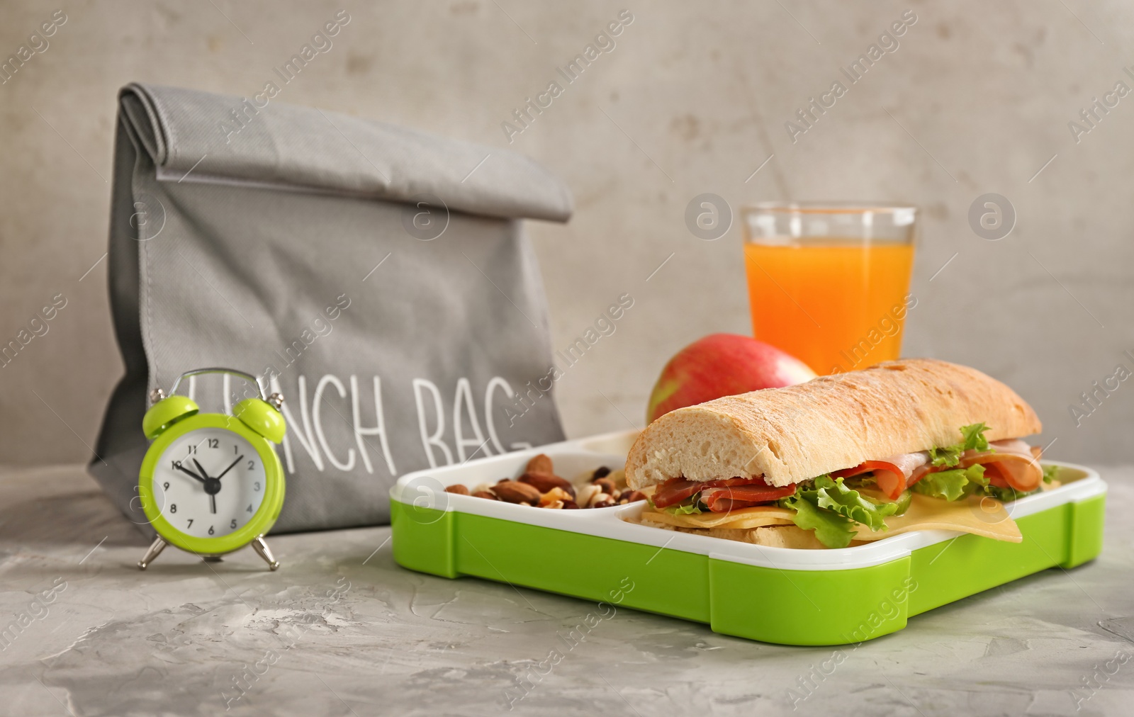 Photo of Composition with lunch box on gray background