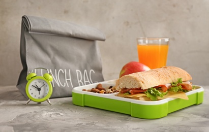 Photo of Composition with lunch box on gray background