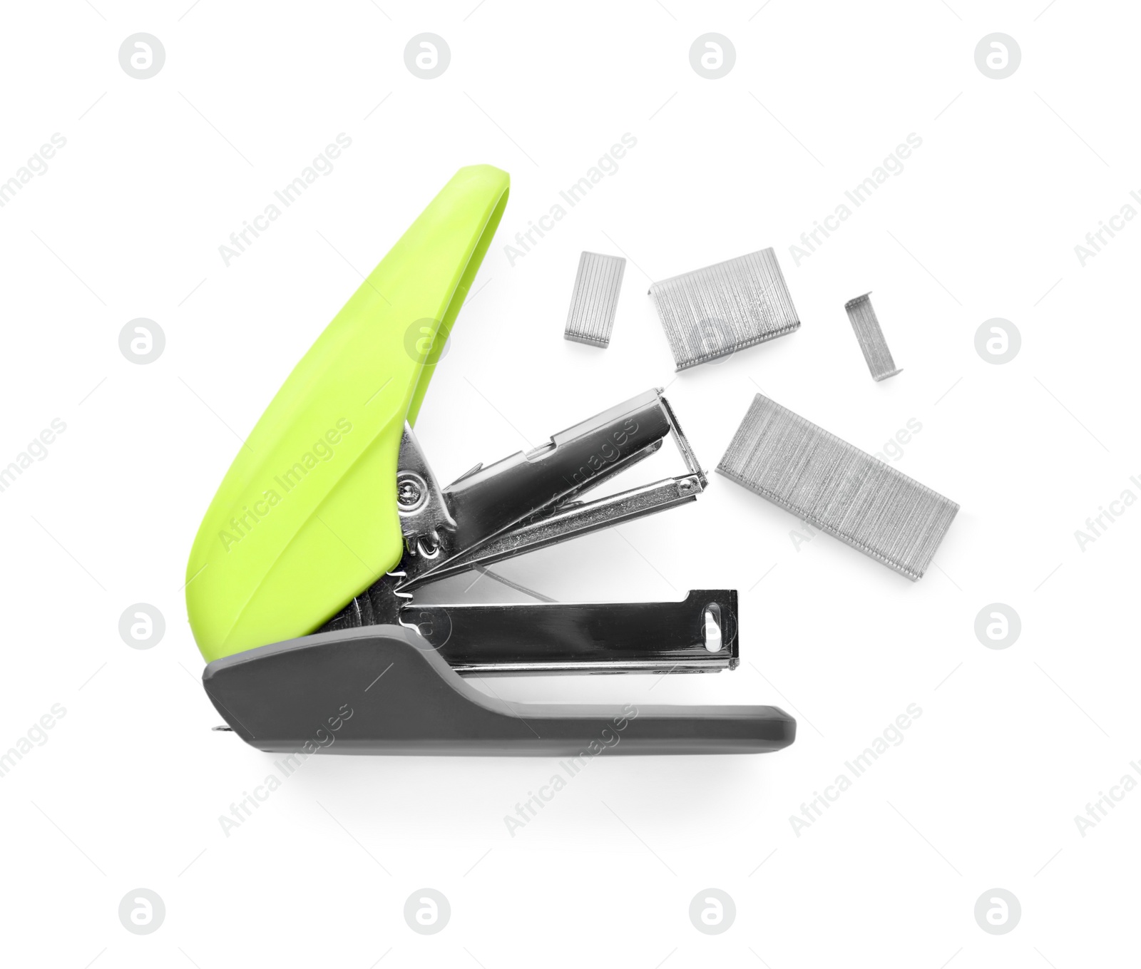 Photo of Bright green stapler with staples isolated on white, top view