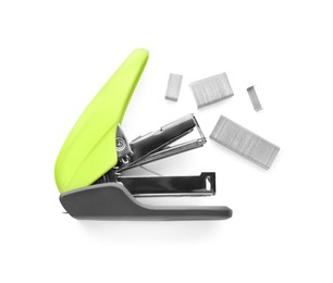 Photo of Bright green stapler with staples isolated on white, top view