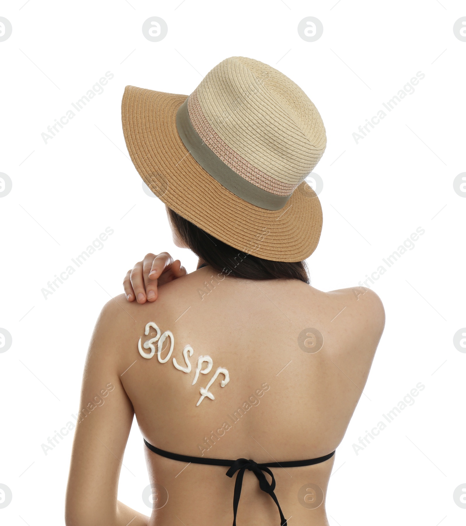 Photo of Text 30 SPF written with sun protection cream on woman's back against white background