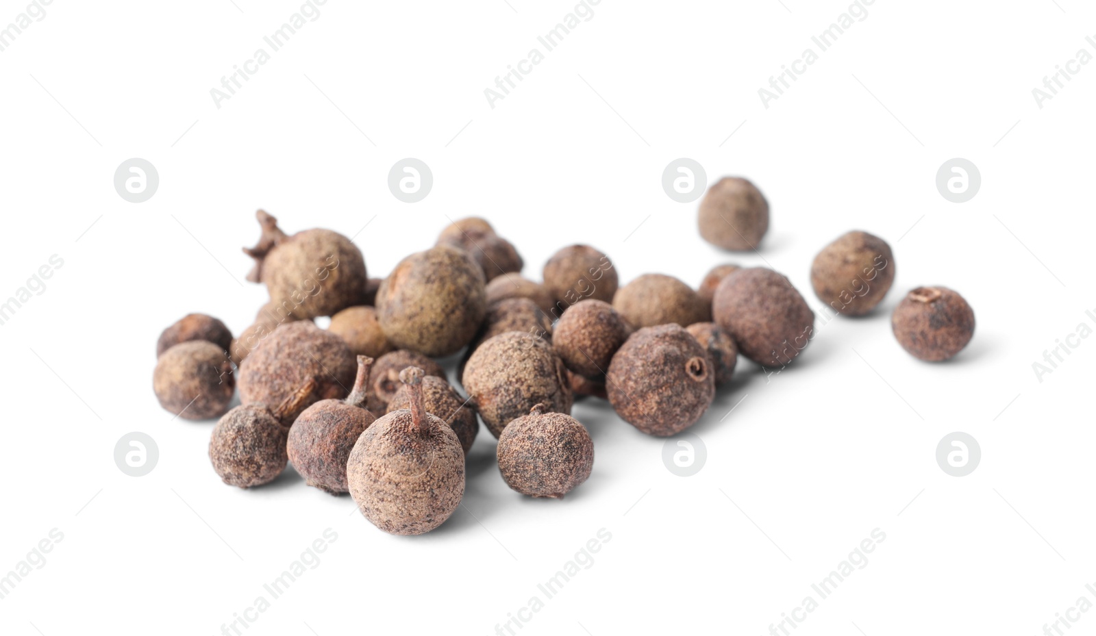 Photo of Heap of black pepper grains isolated on white