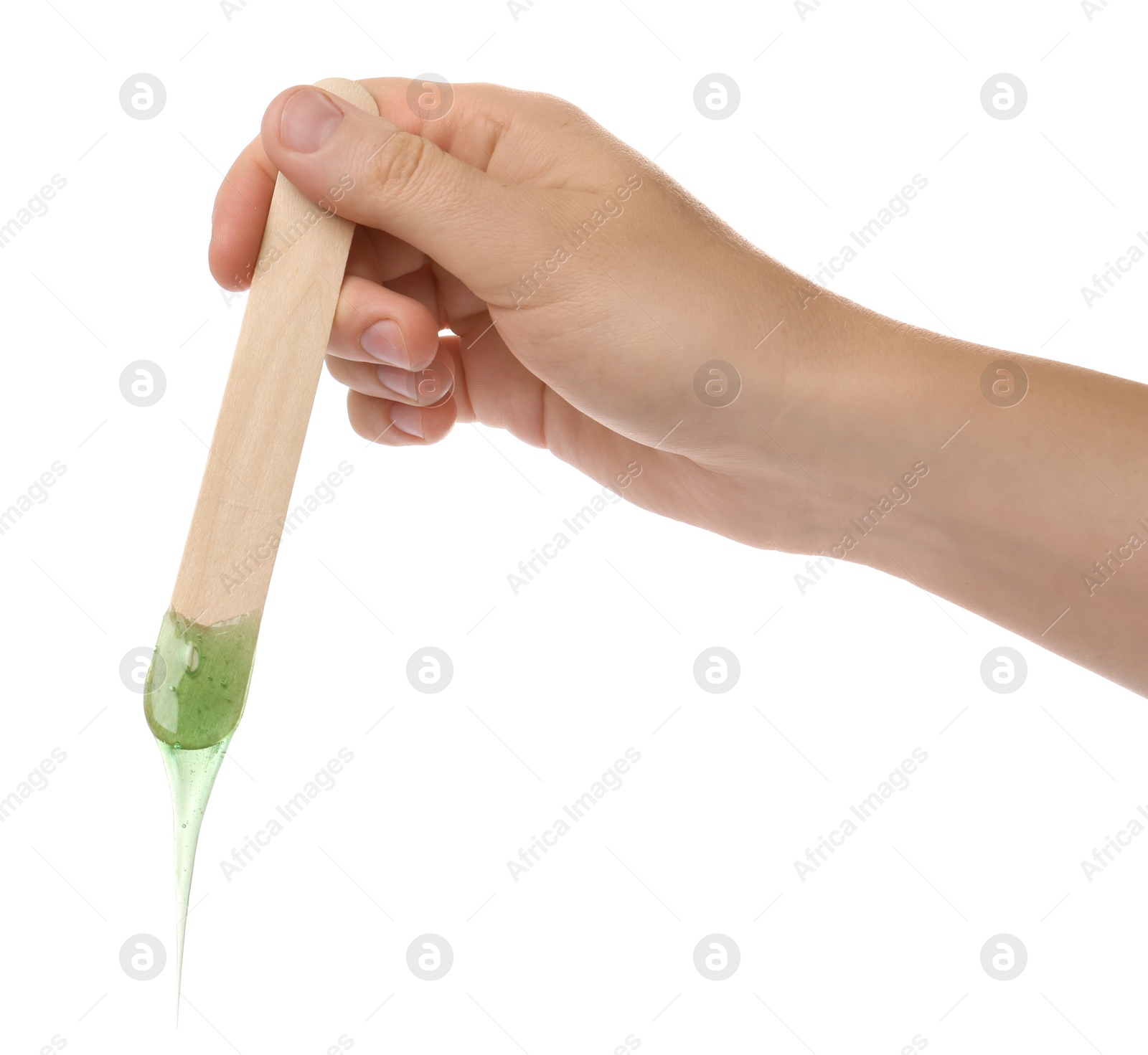 Photo of Woman holding spatula with hot depilatory wax on white background, closeup