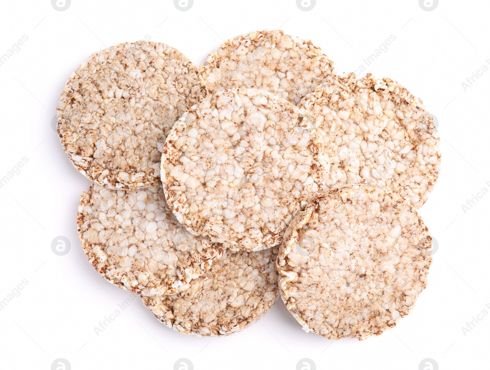 Photo of Many crunchy buckwheat cakes on white background, top view