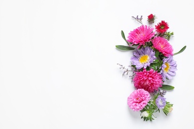 Photo of Composition with beautiful aster flowers on white background, top view