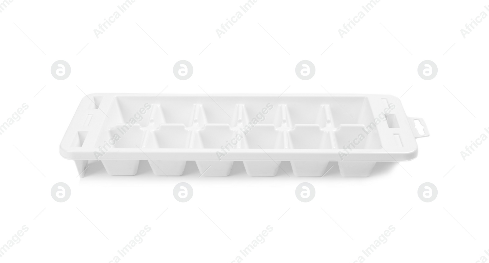 Photo of Empty ice cube tray on white background