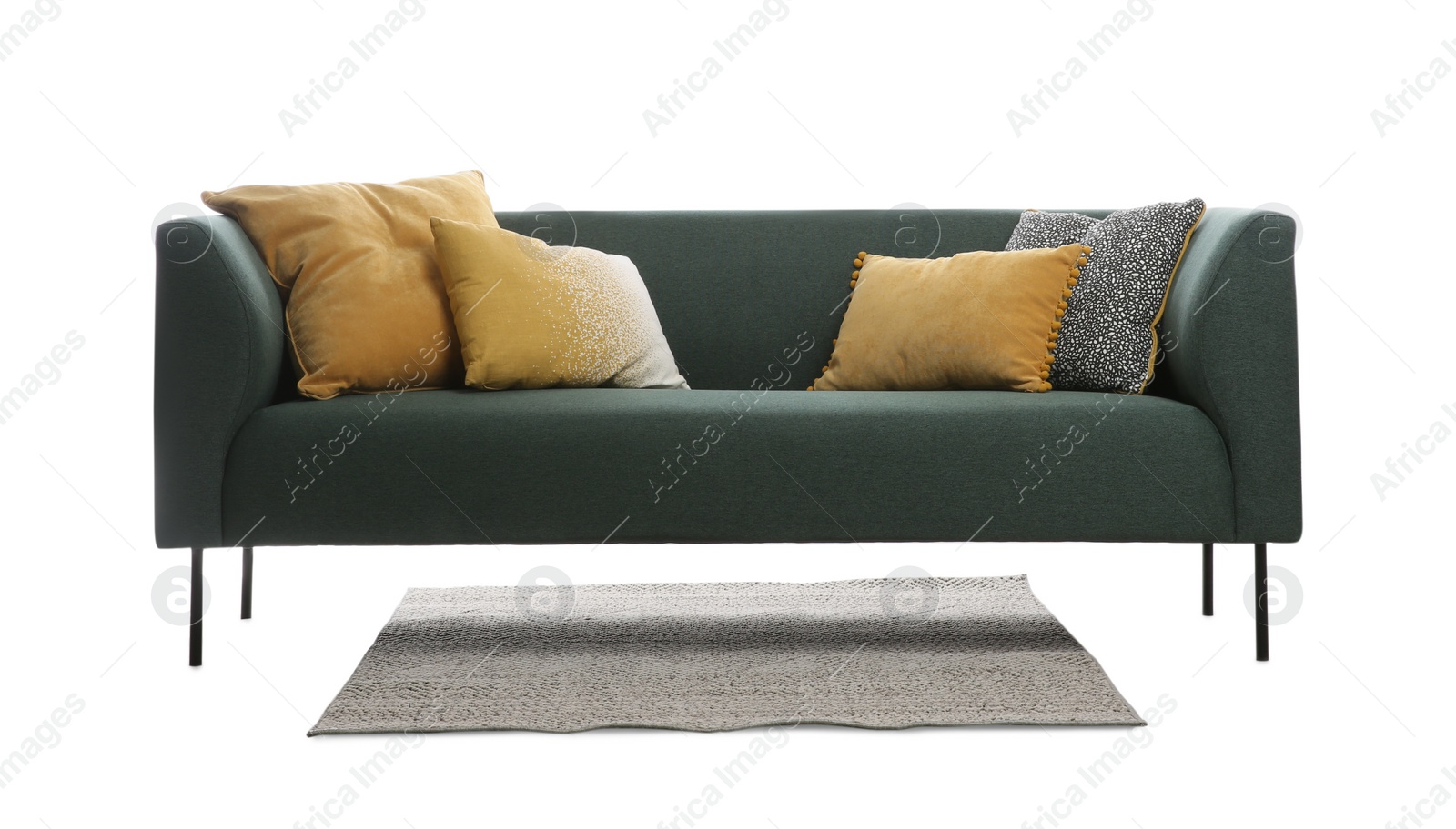 Photo of Comfortable green sofa with cushions and rug on white background. Furniture for living room interior