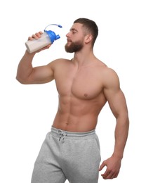 Photo of Young man with muscular body holding shaker of protein on white background