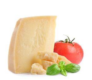 Delicious parmesan cheese, tomato and basil on white background