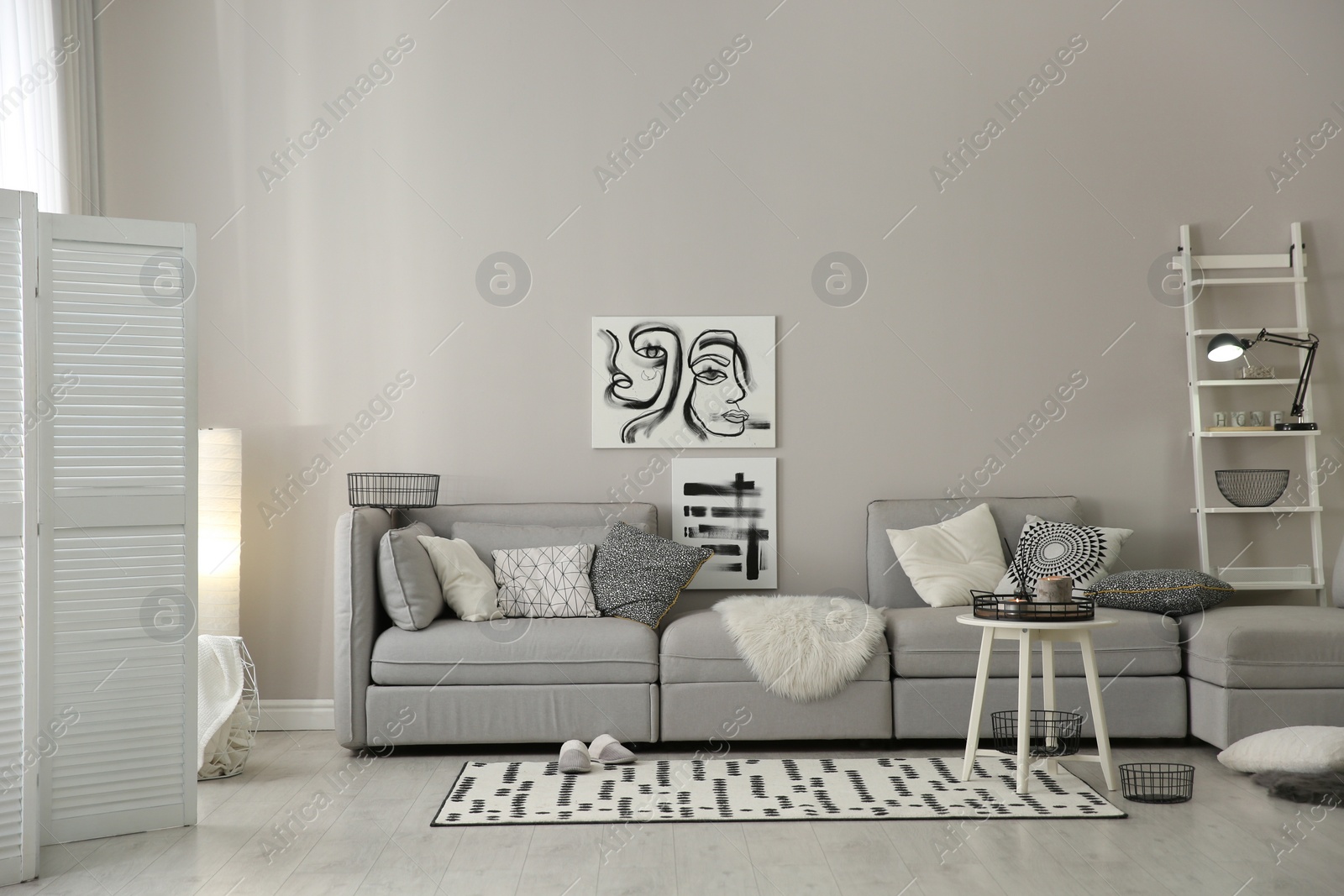 Photo of Cozy living room interior with big grey sofa