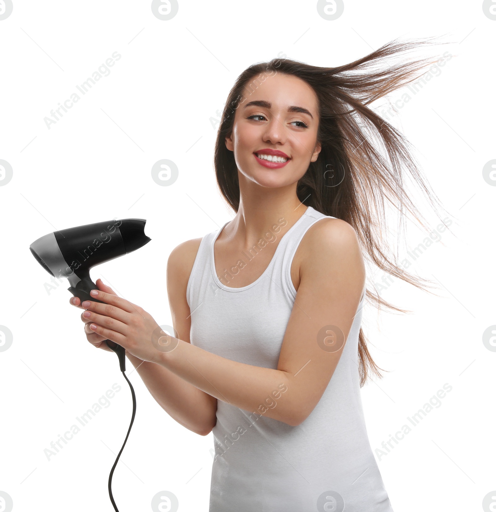 Photo of Beautiful young woman using hair dryer on white background