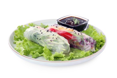 Photo of Plate with delicious rolls wrapped in rice paper and teriyaki sauce on white background