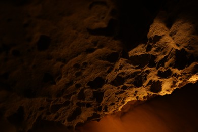 Photo of Many stalactite formations in cave, closeup view