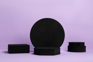 Many black geometric figures on violet background. Stylish presentation for product