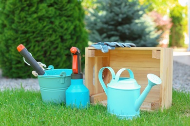 Set of gardening tools on green grass