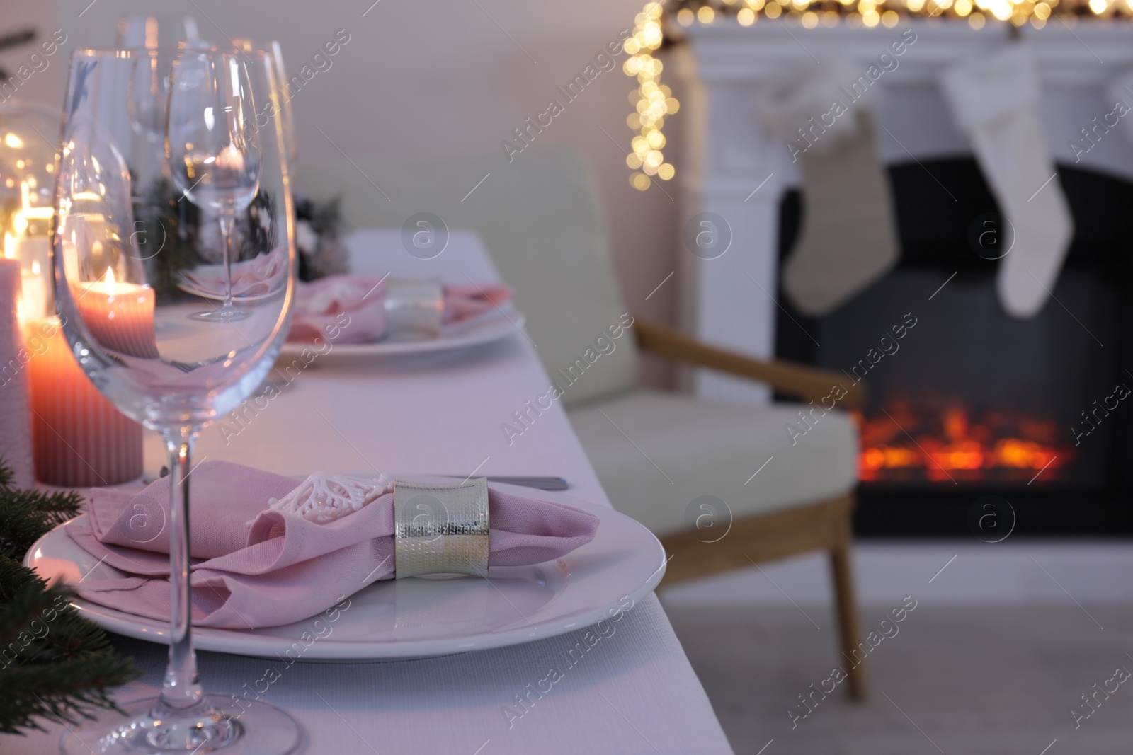 Photo of Beautiful festive place setting with Christmas decor on table indoors, space for text