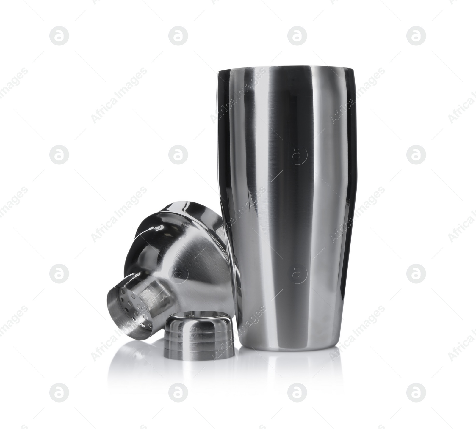 Photo of Metal cocktail shaker, strainer and cap isolated on white