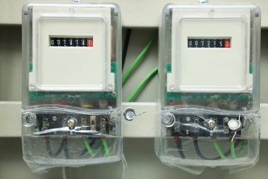 Photo of Electric meters and wires in fuse box, closeup