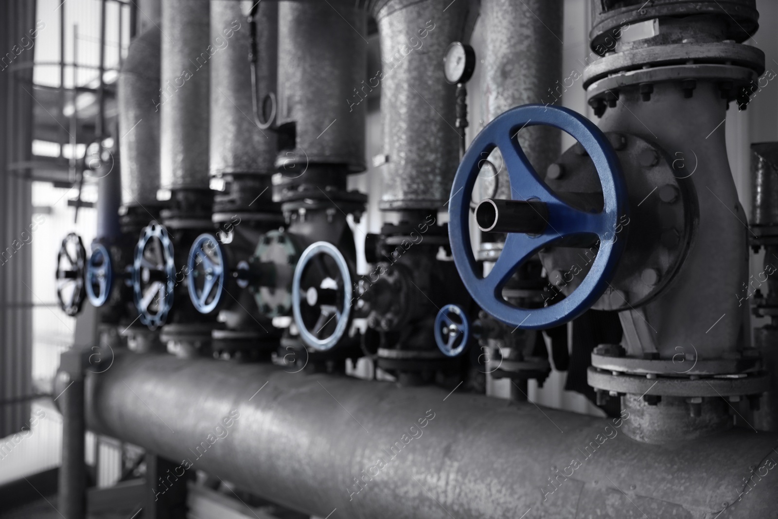 Photo of Pump control valves at modern granary, closeup view