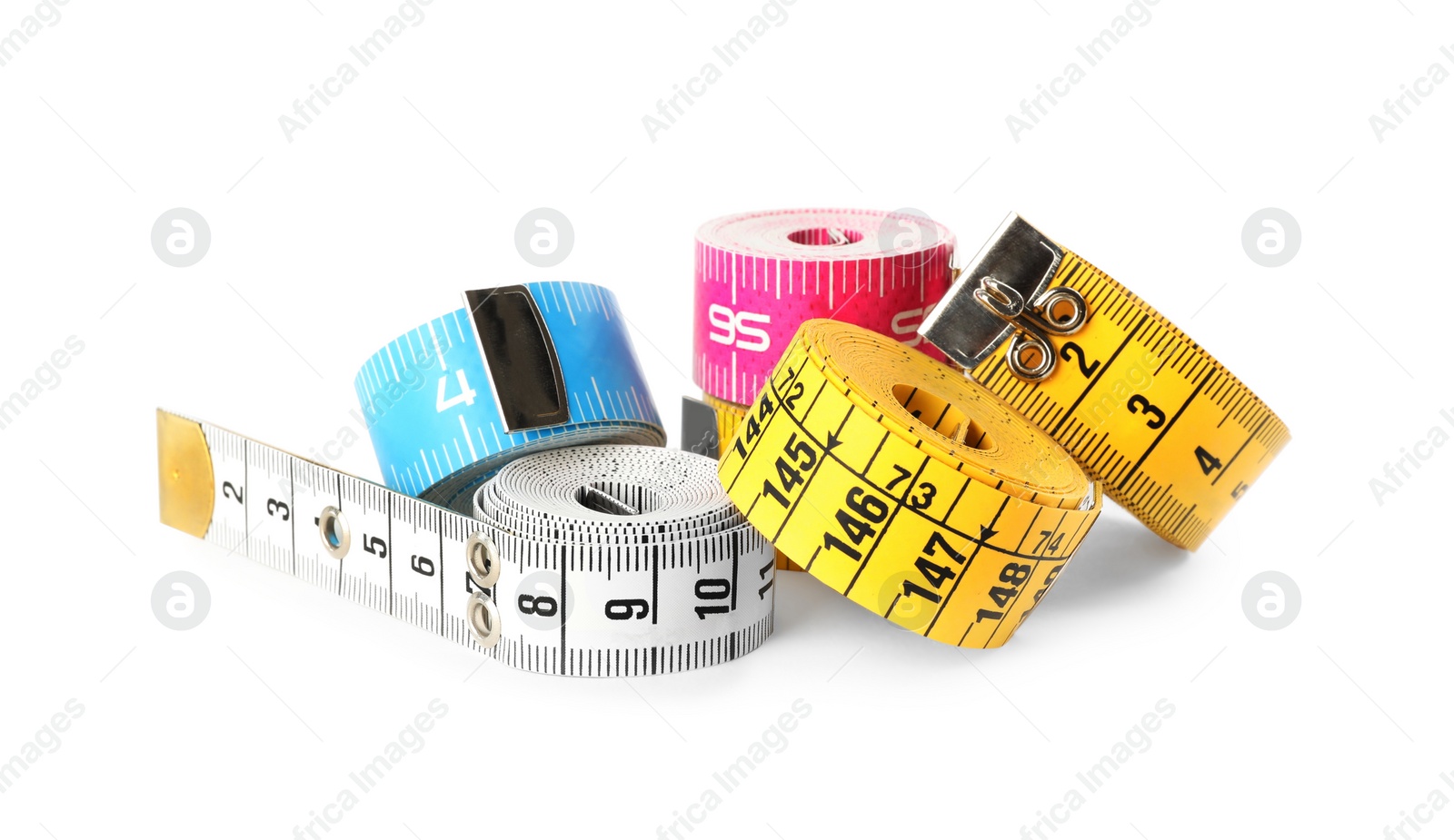Photo of Kit of different measuring tapes isolated on white