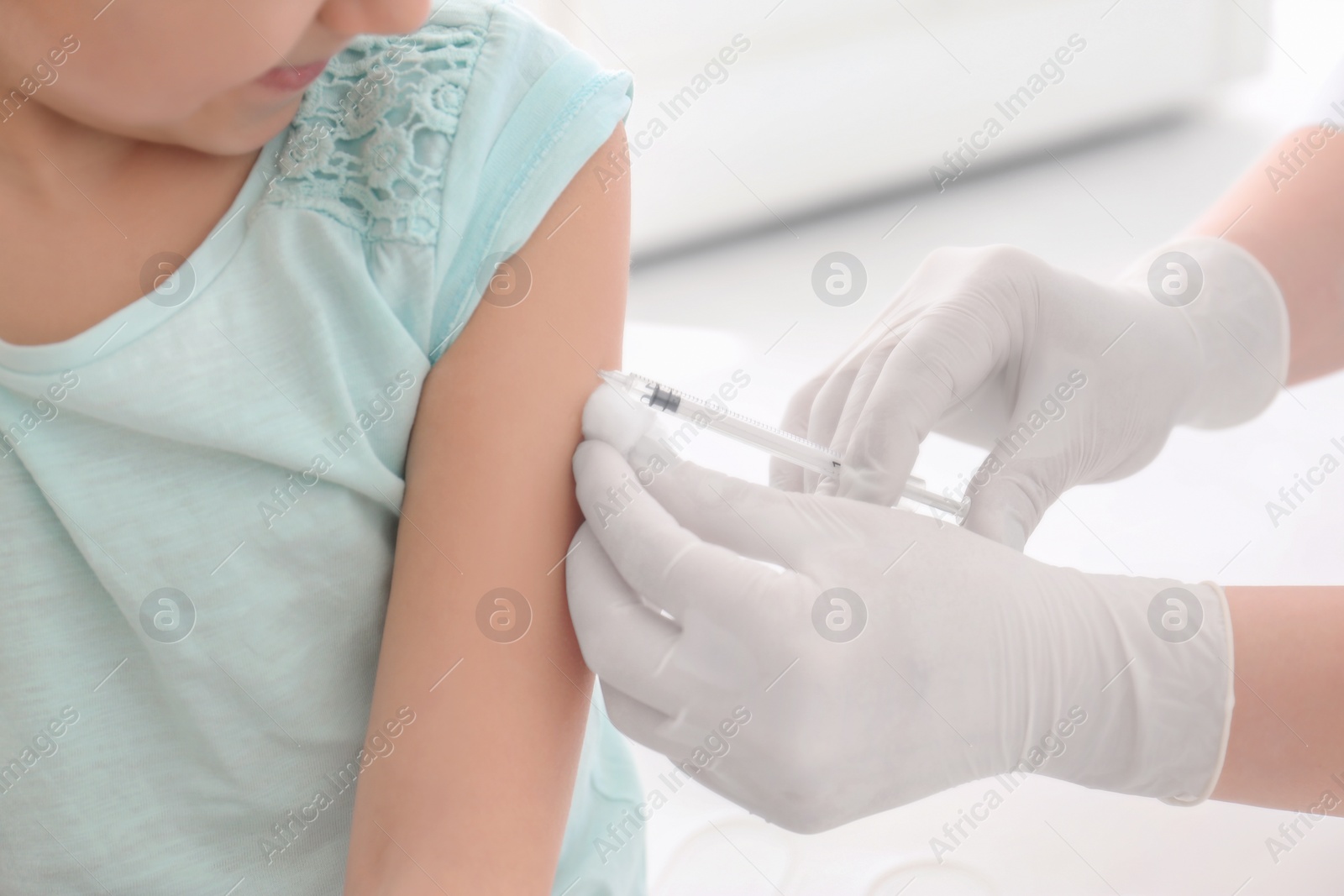 Photo of Doctor vaccinating little girl in hospital