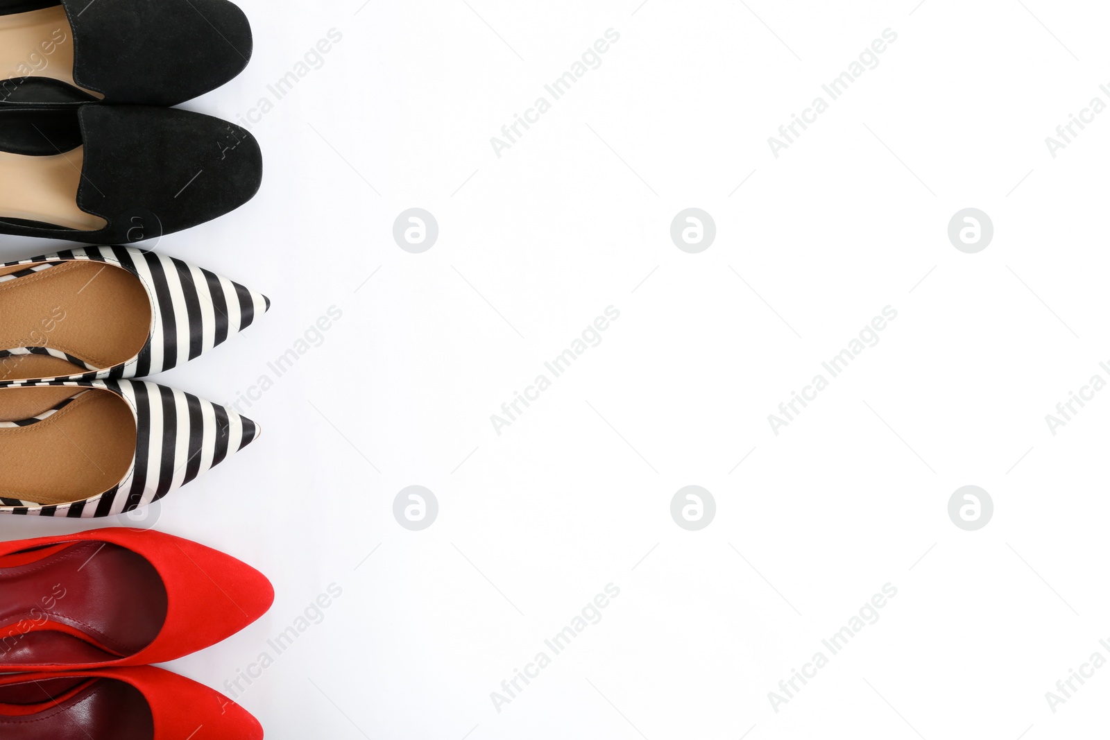 Photo of Different shoes on white background, top view