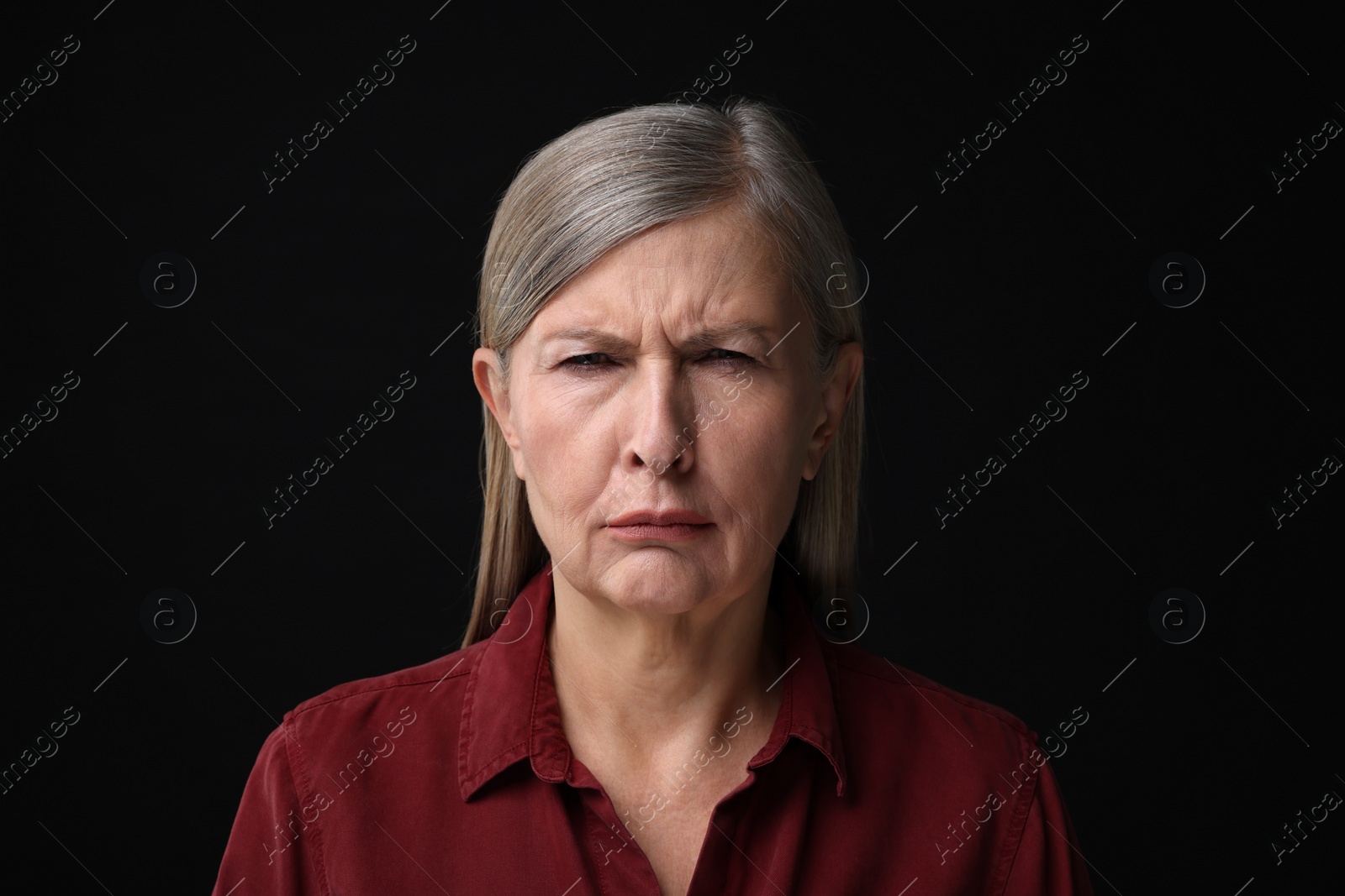 Photo of Personality concept. Portrait of emotional woman on black background