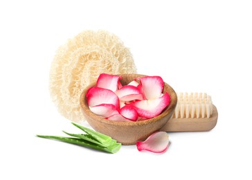 Beautiful composition with bowl of rose petals, loofah sponge and bamboo brush on white background. Spa therapy