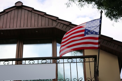 Photo of National flag of USA on building facade