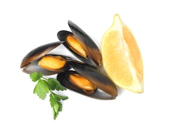 Cooked mussels with parsley and lemon on white background, top view
