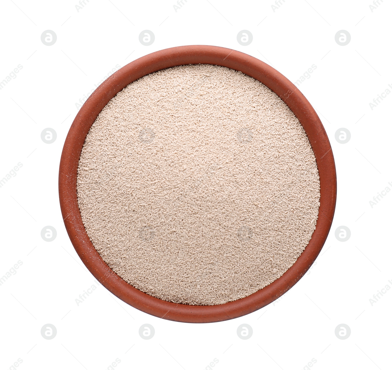 Photo of Bowl of active dry yeast isolated on white, top view