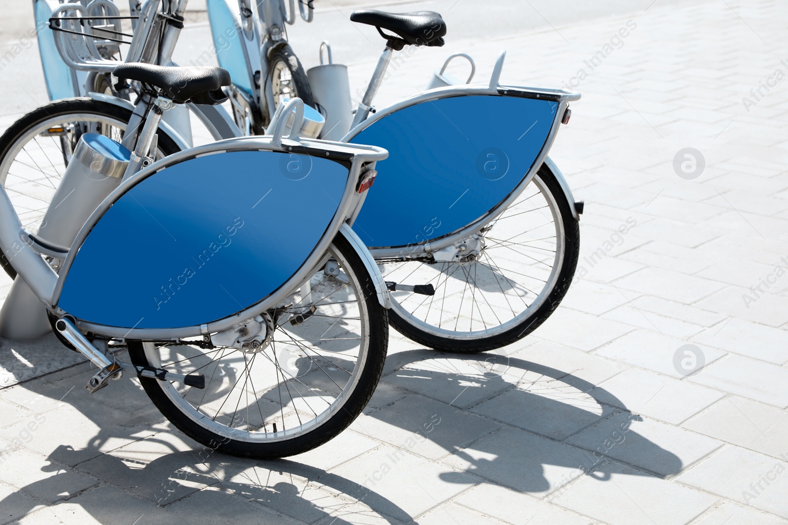 Photo of Parking station with bicycles for rent outdoors