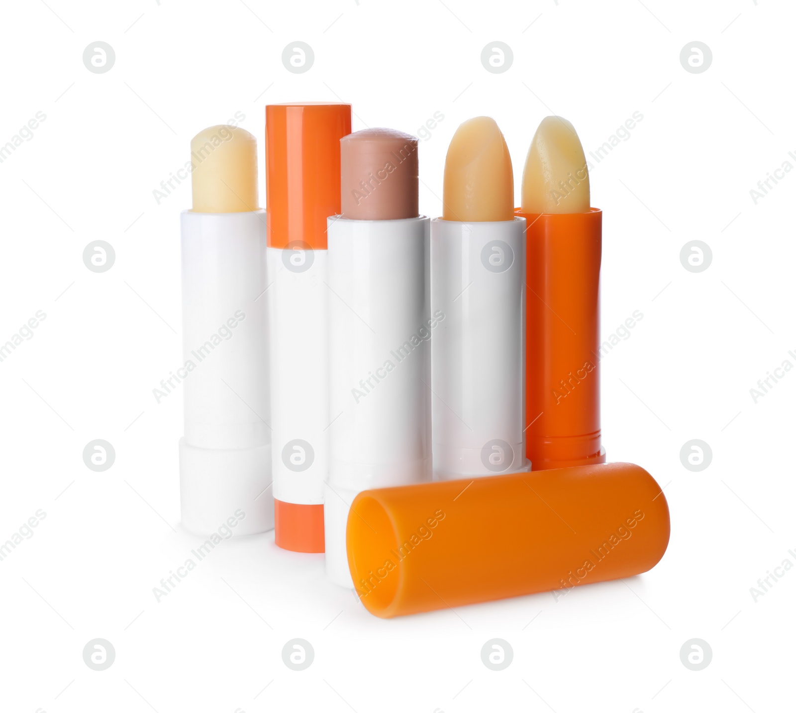 Photo of Sun protection lip balms on white background