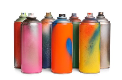 Photo of Used cans of spray paints on white background