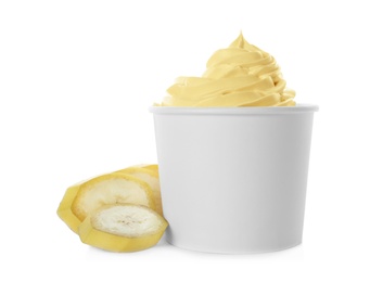 Photo of Cup of tasty frozen yogurt with banana on white background