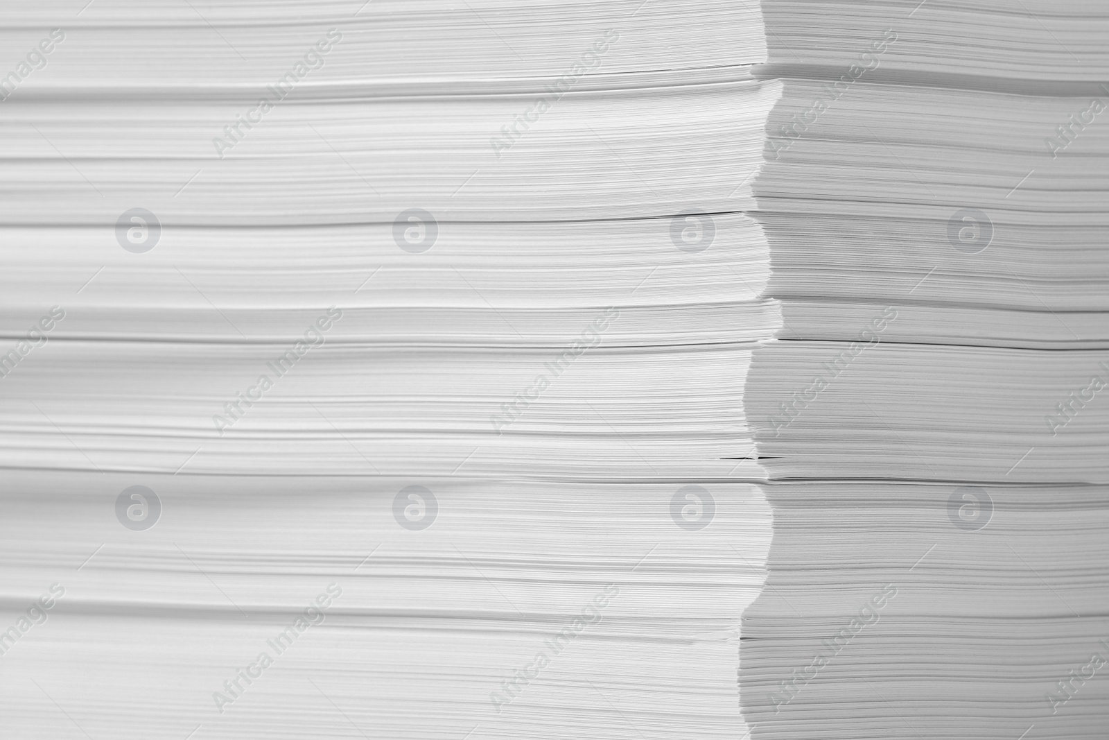 Photo of Stack of paper sheets as background, closeup