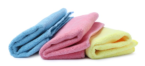 Photo of Many colorful microfiber cloths on white background