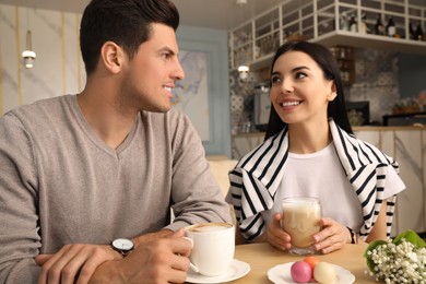 Lovely couple on date at cafe in morning