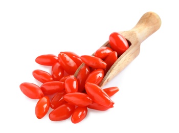 Fresh ripe goji berries and wooden scoop on white background