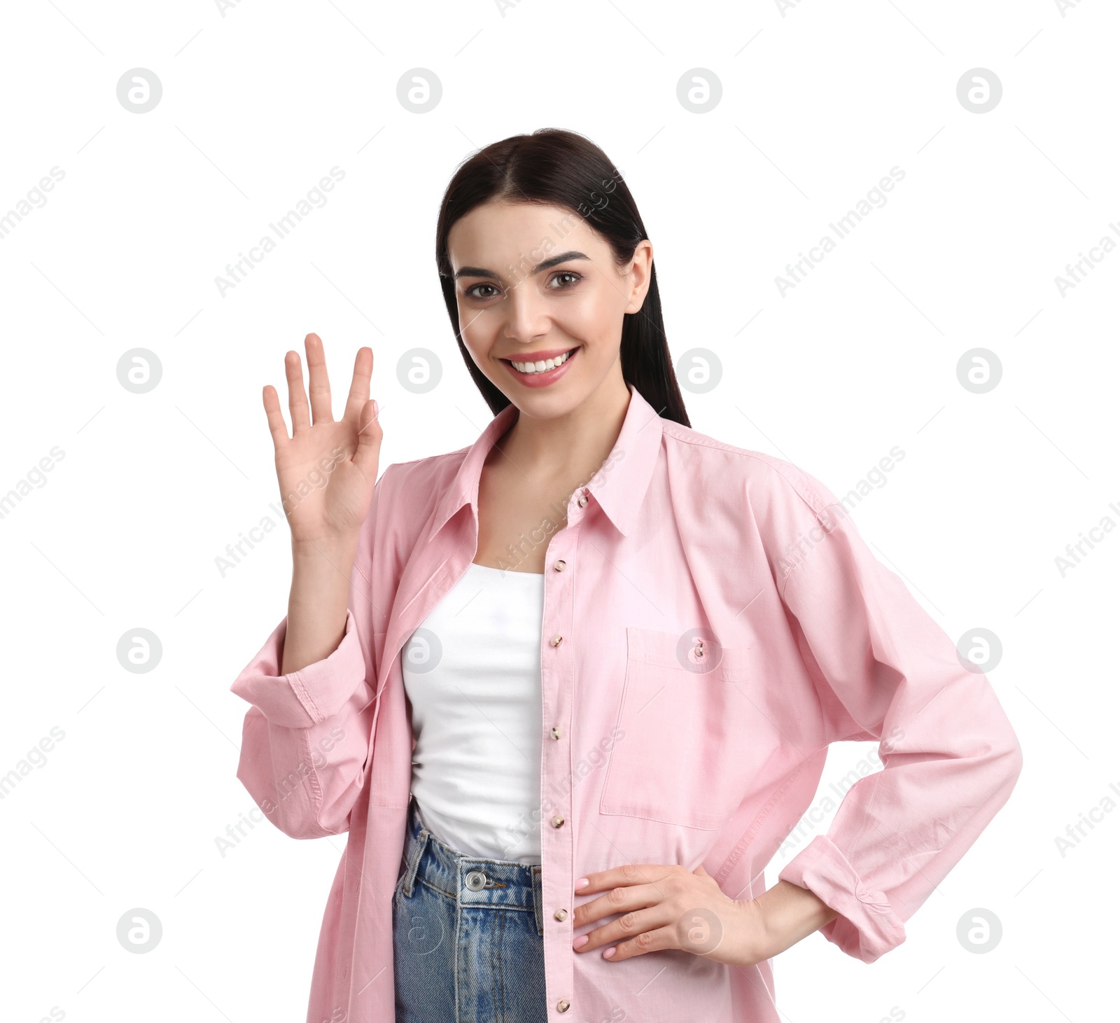 Photo of Attractive young woman showing hello gesture on white background