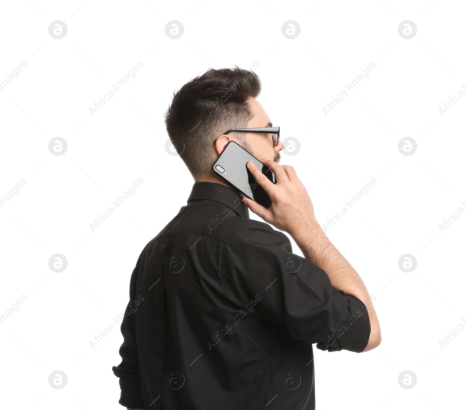 Photo of Young businessman talking on smartphone against white background