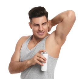 Photo of Handsome man applying deodorant to armpit on white background