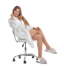 Photo of Young woman in bathrobe on white background