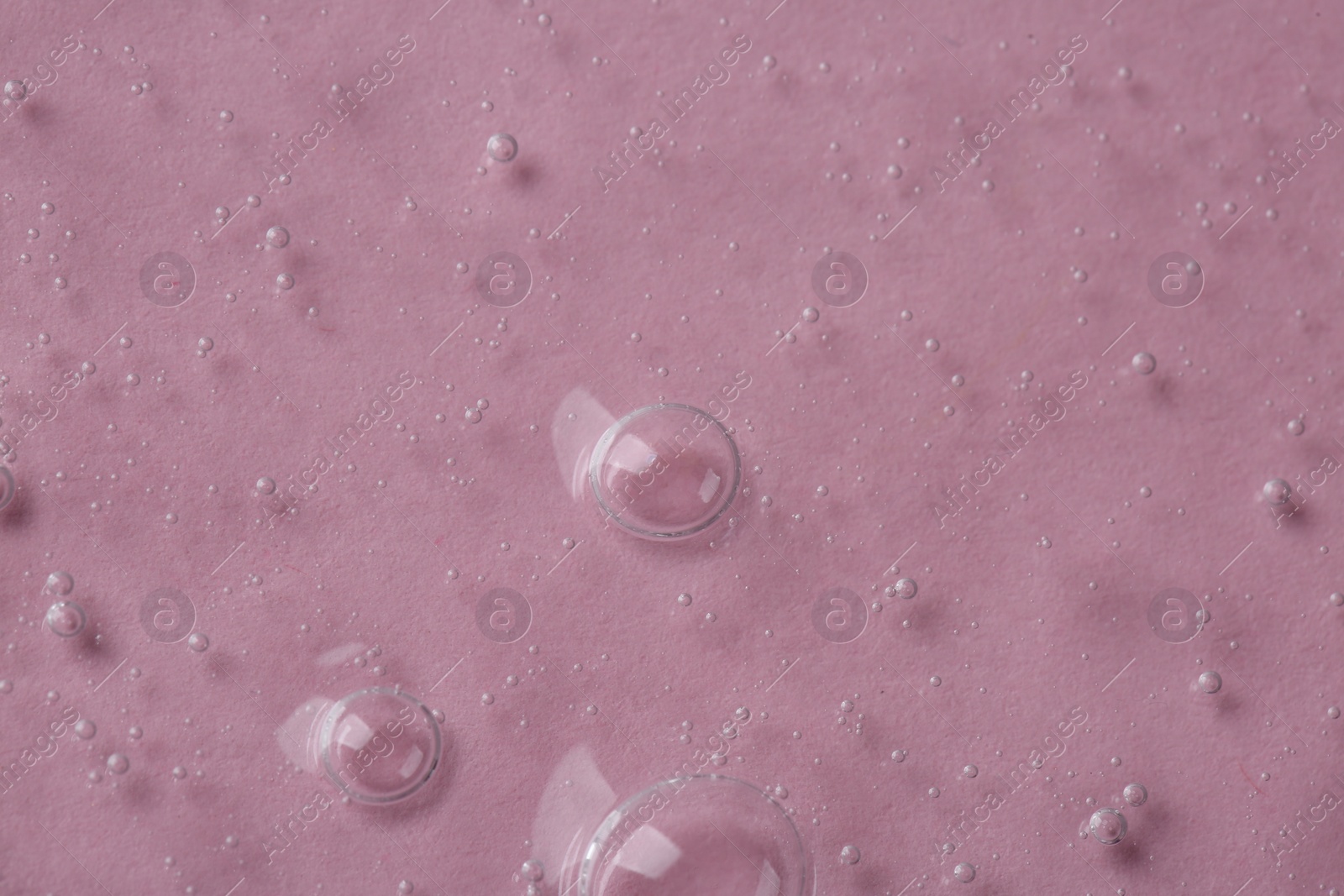 Photo of Cosmetic serum on pink background, above view