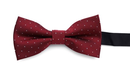 Photo of Stylish burgundy bow tie with polka dot pattern on white background, top view