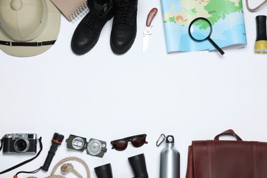 Flat lay composition with different safari accessories on white background. Space for text